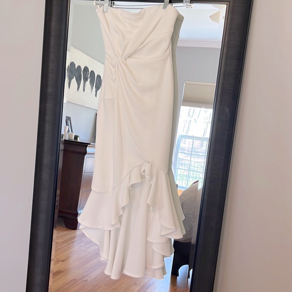 saints and secrets Dresses & Skirts - White off the shoulder Saints and Secrets asymmetrical dress.